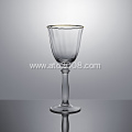 Gold rimmed crystal champagne flutes